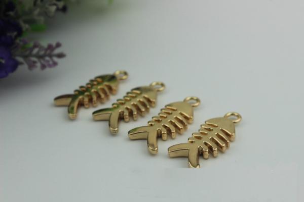 Small light gold fish bones pattern zinc alloy metal handbag logo label tags for sales
