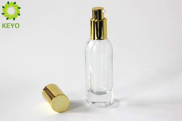 Clear Glass Foundation Bottle 30ml Thick Bottom Type With Gold Aluminium Pump
