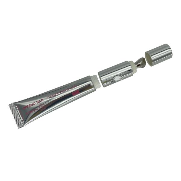 Customized Lotion Squeeze Tube Eye Cream Massage Packaging Cosmetic Plastic Soft Tube with Massage Applicator Zinc Alloy