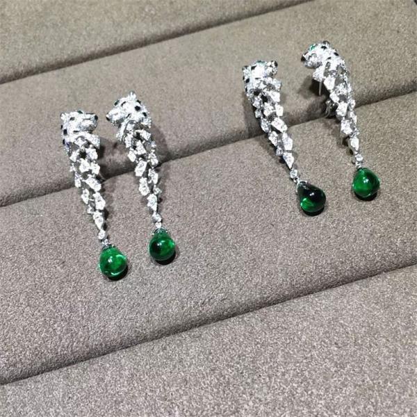 C Cheetah Earrings - showing the charm of courage, naughty or docile .310 round bright cut diamonds, emerald and onyx.