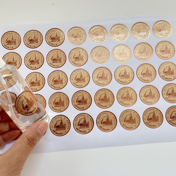Hot Sale Custom Round Adhesive Label Vinyl Embossed Rose Gold Foil Texture Paper Perfume Bottle  Circle Label Sticker Sheet