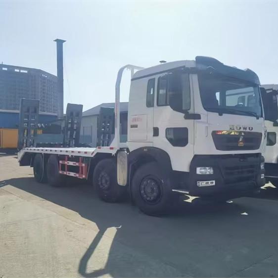 Large Capacity12 Wheels 20ton 25ton Excavator Transfer Howo Flat Bed Transport Truck