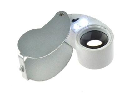 A lupa da jóia da promoção com luz do diodo emissor de luz e ampliação de 10X e o tamanho da lente são 25mm