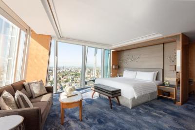 Star Hotel Room Furniture Upholstered bed with Sofa chairs and Fixed wood Panels in Wall Wardrobe cabinets