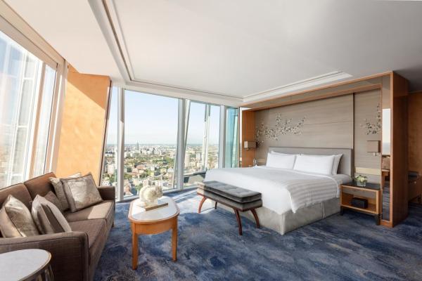 Star Hotel Room Furniture Upholstered bed with Sofa chairs and Fixed wood Panels in Wall Wardrobe cabinets