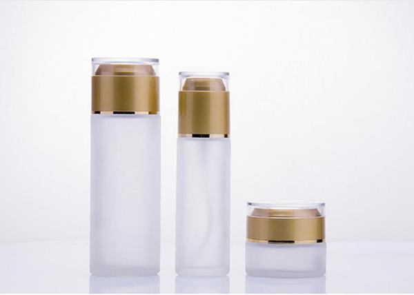 Le verre cosmétique rond met/bouteille en bouteille en verre de lotion avec la pompe