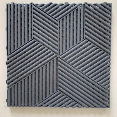 Carreaux de sol de garage en plastique gris entrelacés