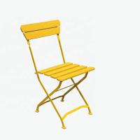 O quadro revestido de dobramento amarelo exterior do tubo do pó de metal da cadeira de sala de estar da praia dobra acima o vadio da praia