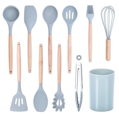 O punho de madeira, utensílios resistentes ao calor da cozinha do silicone ajustou um cinza de 11 PCes