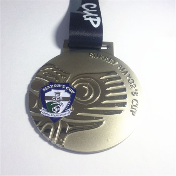 Metal enamel medal in the form of a T-shirt as a commemorative item