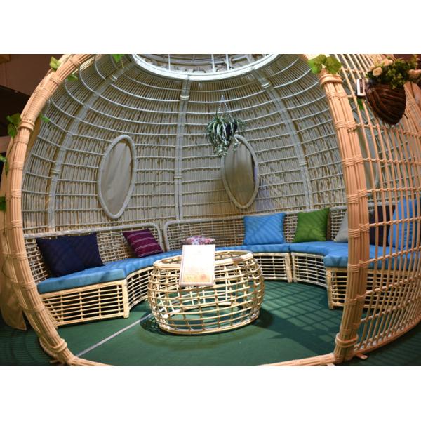 Transform Your Patio into a Relaxing Haven with a Rattan Daybed and Canopy