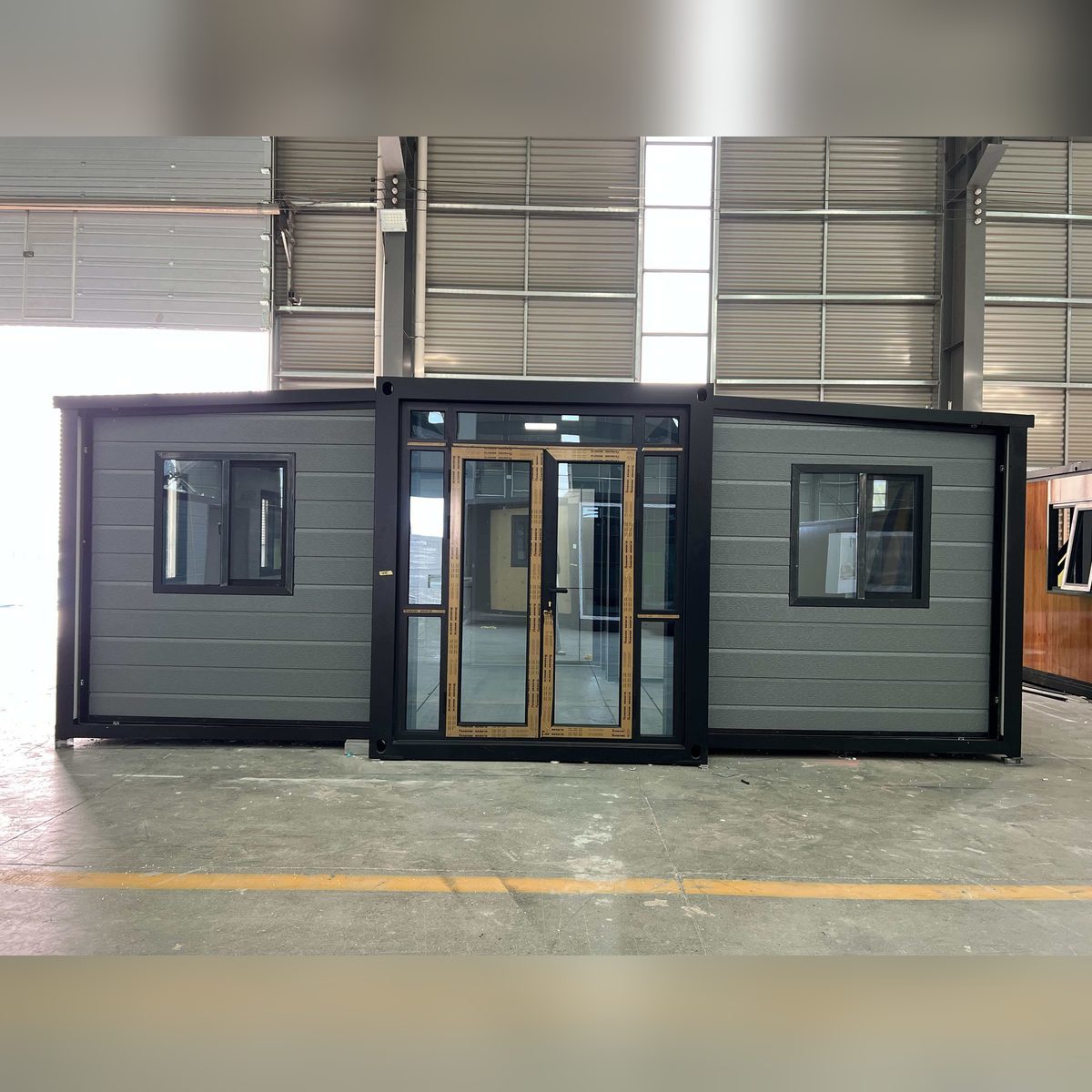 20ft Expandable Container House with Grey Cladding, Black Frame and Fitted Interior