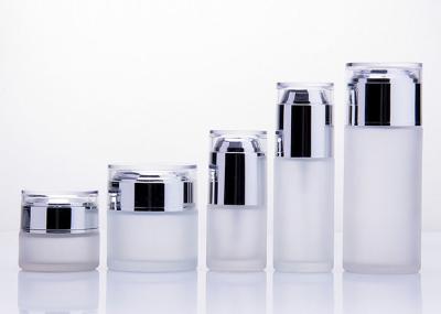 Le verre cosmétique rond met/bouteille en bouteille en verre de lotion avec la pompe