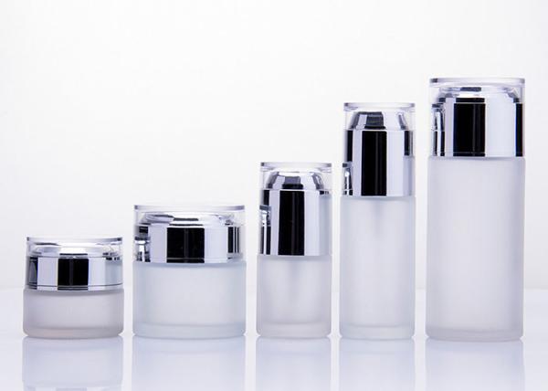 Le verre cosmétique rond met/bouteille en bouteille en verre de lotion avec la pompe