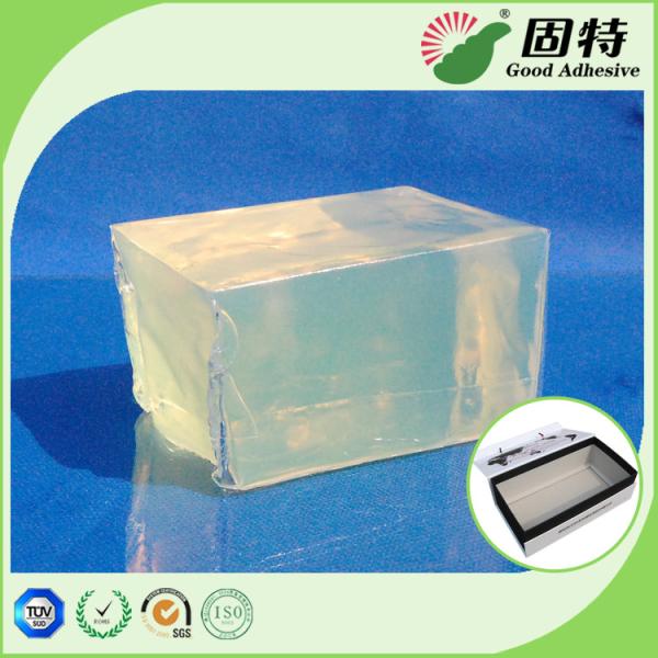 Esparadrapo quente transparente claro da colagem do derretimento do bloco forte amarelo e semi-transparente que empacota para a ligação da caixa de presente