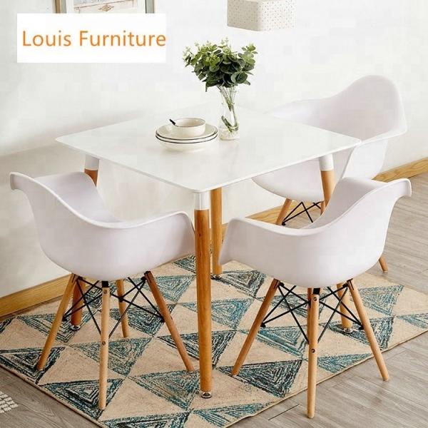 White Plastic Dining Chairs With Wooden Legs Crossover And Triangular Designed