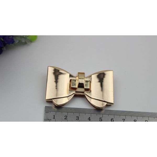 High polish gold metal bow-knot pattern zinc alloy fashion twist turn locks for purse