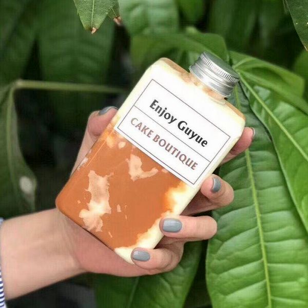 Ясные пластиковые бутылки напитка консервируют 650ml с герметизируя машиной с подгонянным логотипом