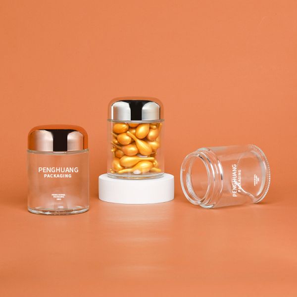 Round 100g Capsule Glass Container With Rose Golden Cap Sliver Cap Glass Jar Packaing
