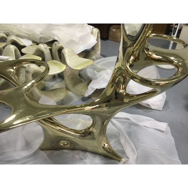 Stainless steel sculptural table with abstract style dresser interior decoration