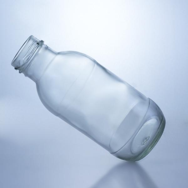 Solução de armazenamento de líquido Solução de armazenamento de 300 ml de garrafa de vidro redonda de leite com tampa