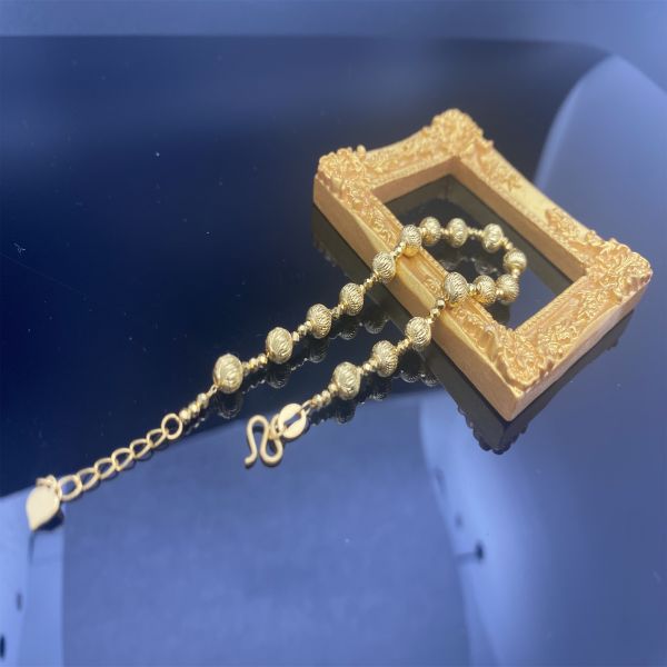 Lujoso brazalete de corazón de oro amarillo de 18K