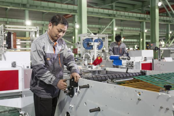 CE approved HDPE LDPE plastic folded draw tape Pampers diaper bag making machine