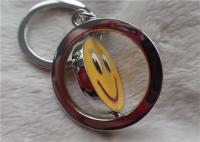 Regalos promocionales personalizados llavero de plata del color con la cara amarilla sonriente rotativa