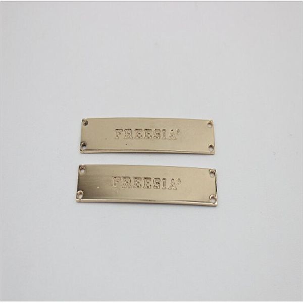 Supply custom gold iron debossed logo metal shoe accessories metal buckles for shoelace