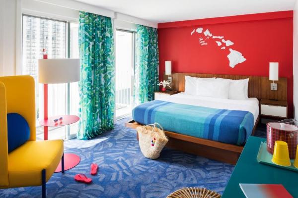 Trat province hotel double beds room by Laminate wood headboard bed with nightstand and Metal legs lounge chairs