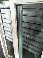 Fenêtre coulissante en UPVC à maillage de sécurité pour le remplacement de maisons résidentielles