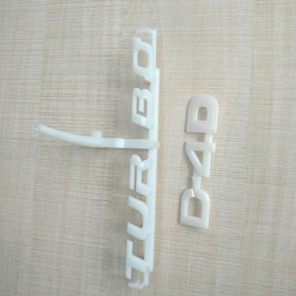 White / Ivory Automotive Plastic Injection Molding Custom Vehicle Logos Sub Gate Type