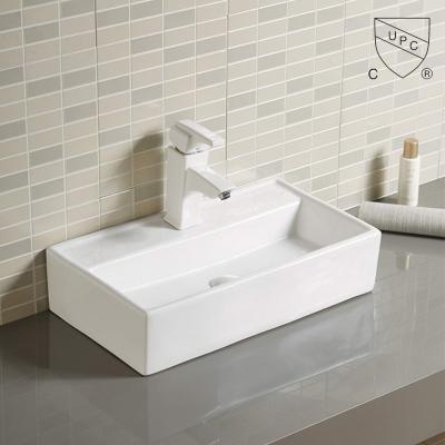 Le navire lisse et élégant descend la salle de bains en céramique unique au-dessus du lavabo supérieur