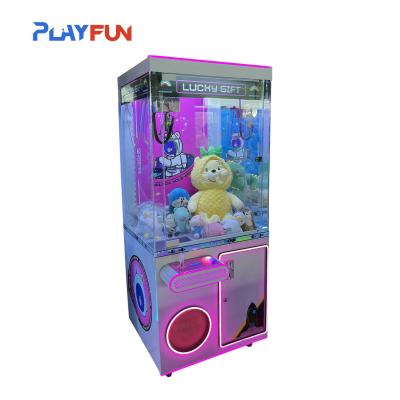 O presente da sorte é uma máquina de garra de garra de boneca, uma máquina de garra de brinquedo, uma máquina de garra de brinquedo.