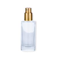 Bouteille de parfum unique en verre 50 ml emballage cosmétique cylindre avec tête de pulvérisation d'or