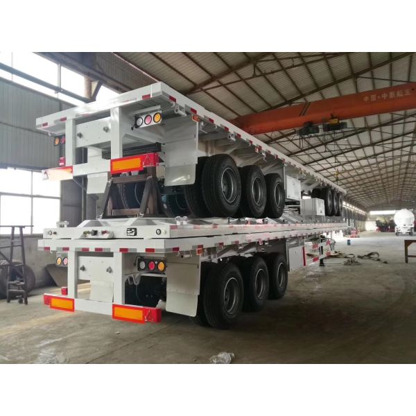 Customizable Flat Bed Semi Trailer with 40-60t Load Capacity, High-strength Steel Construction, and 3 Axles for Heavy-Duty Transport