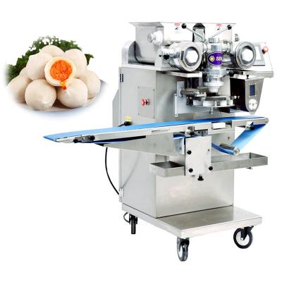 As bolinhas de massa da carne do arroz pescam a bola que faz a máquina completamente automática