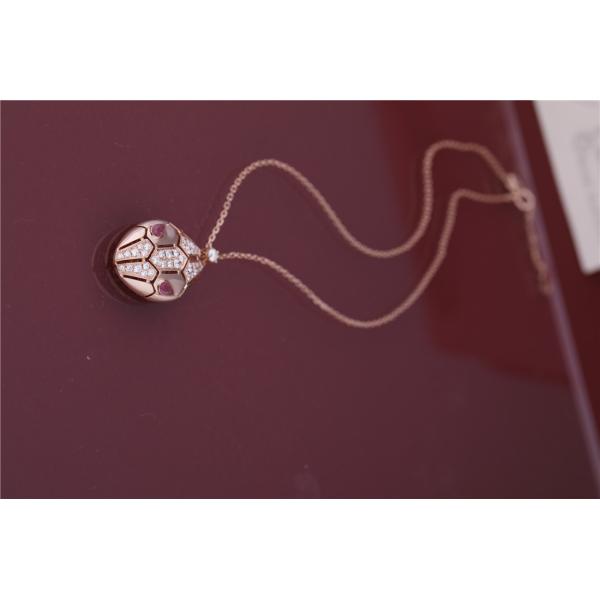 Римское ожерелье Serpenti в 18 kt подняло золото установило с глазами rubellite и с диамантами pavé на голове