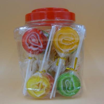 A forma redonda classificou o sabor do fruto em volta dos grandes pirulitos lisos do redemoinho/do alimento doces duros com frascos do PVC