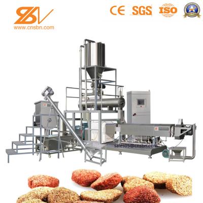 Os peixes do animal de estimação alimentam a máquina de processamento, peixe alimentam o equipamento de processamento