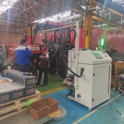 Machine de remplissage et de charge de réfrigérant pour la production de congélateurs