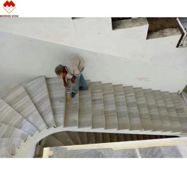 White Wood Look Marble Tiles Stair Follow Veins for a Versatile and Timeless Design