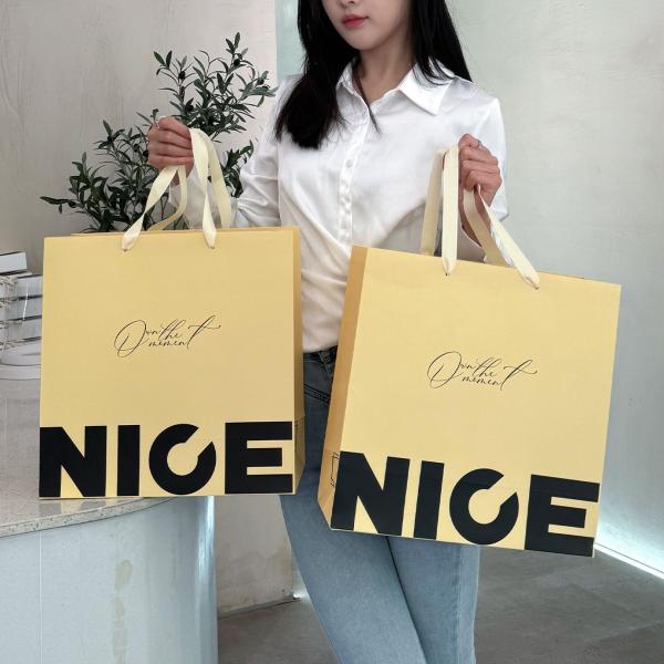 Bolsas de papel ecológicas de impresión a granel Bolsas de papel kraft de impresión de alta calidad para ropa