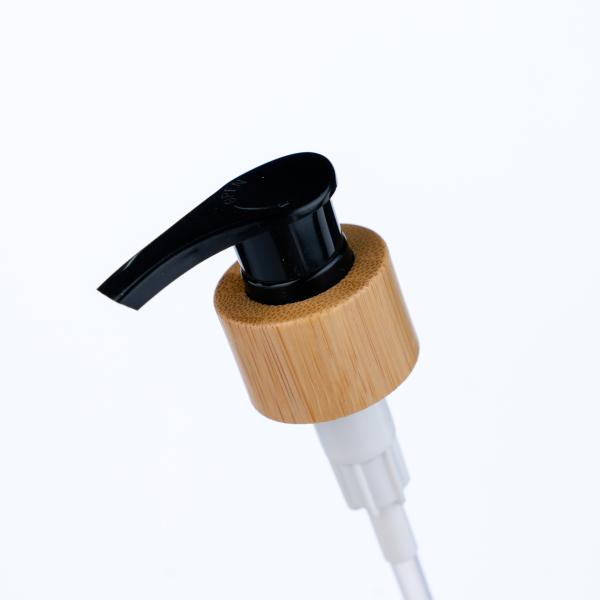 24/410 Pompe à lotion d'impression à transfert d'eau de grain de bois noir est utilisée pour les bouteilles de gel de douche et de crème hydratante