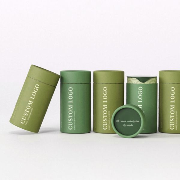 Custom-made eco-friendly, food-grade kraft paper coffee, tea, and salt bottles, packaged in cylindrical cardboard boxes.