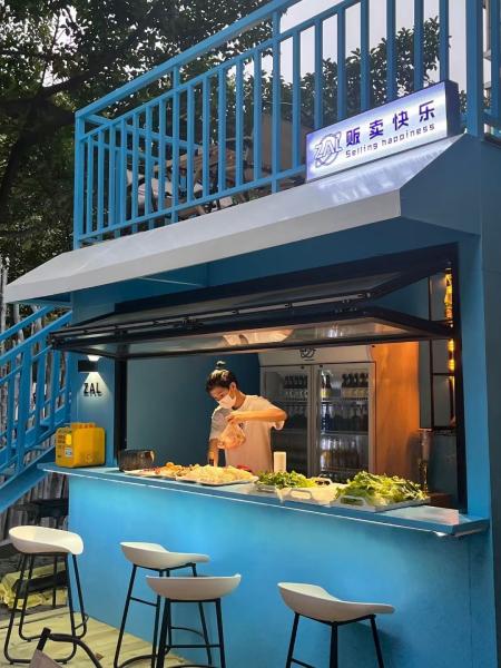 Cooking Station Folding Window Allowing Pass-Through Service to Outdoor Dining Areas During Entertaining