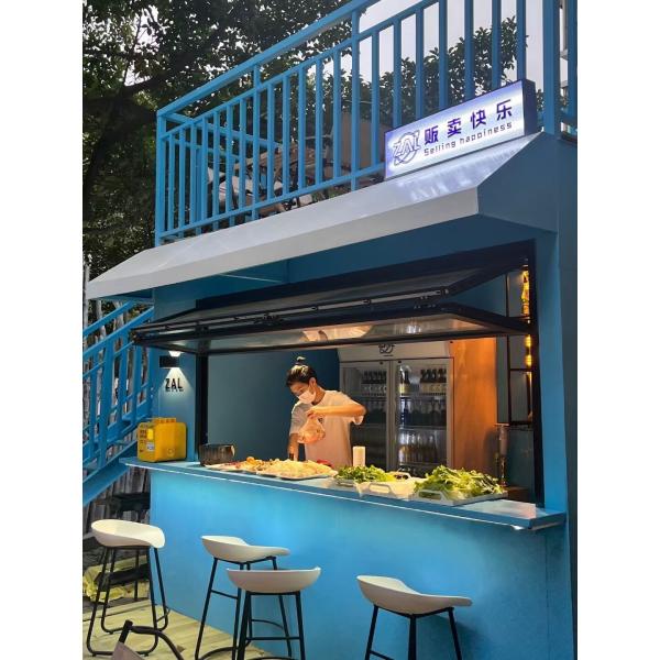 Cooking Station Folding Window Allowing Pass-Through Service to Outdoor Dining Areas During Entertaining