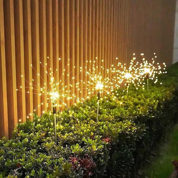 O feriado exterior do diodo emissor de luz ilumina os fios de cobre amarra a luz solar do fogo de artifício da paisagem de DIY