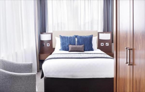 Pahang guestroom hotel furniture factory for fabric padded bed and tall TV cabinet with sofa chairs
