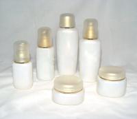 Botellas de cristal y tarros cosméticos helados soplados blancos de la crema